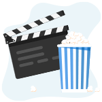 Filmklapper naast een bak popcorn in een blauwe bak